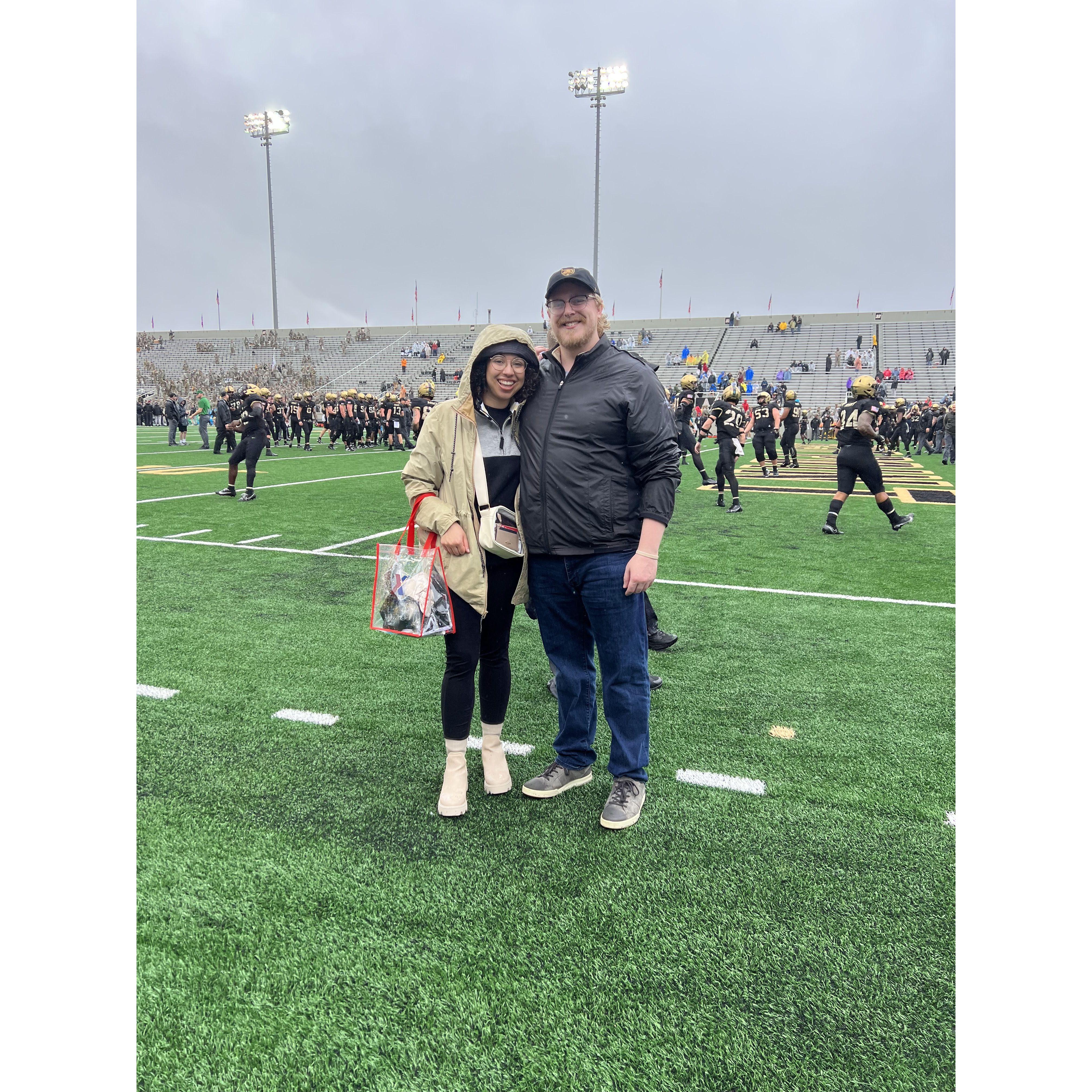 October 2023: A rainy West Point football game (sideline access courtesy Matt's brother!) | Un partido de fútbol de West Point bajo la lluvia (¡acceso a la línea lateral cortesía del hermano de Matt!)