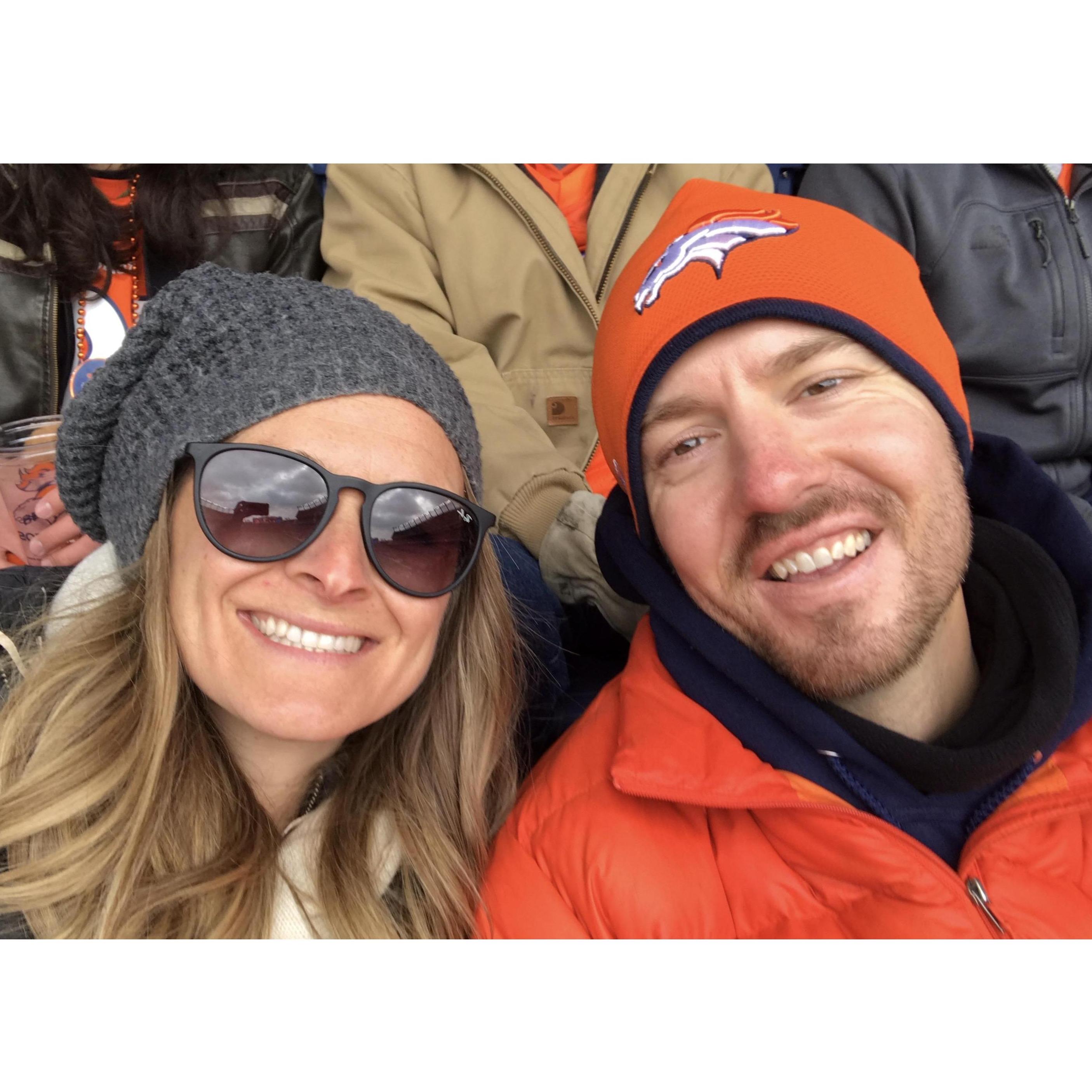 Peter showing Christy the Bronco ropes at a home game Nov 2018