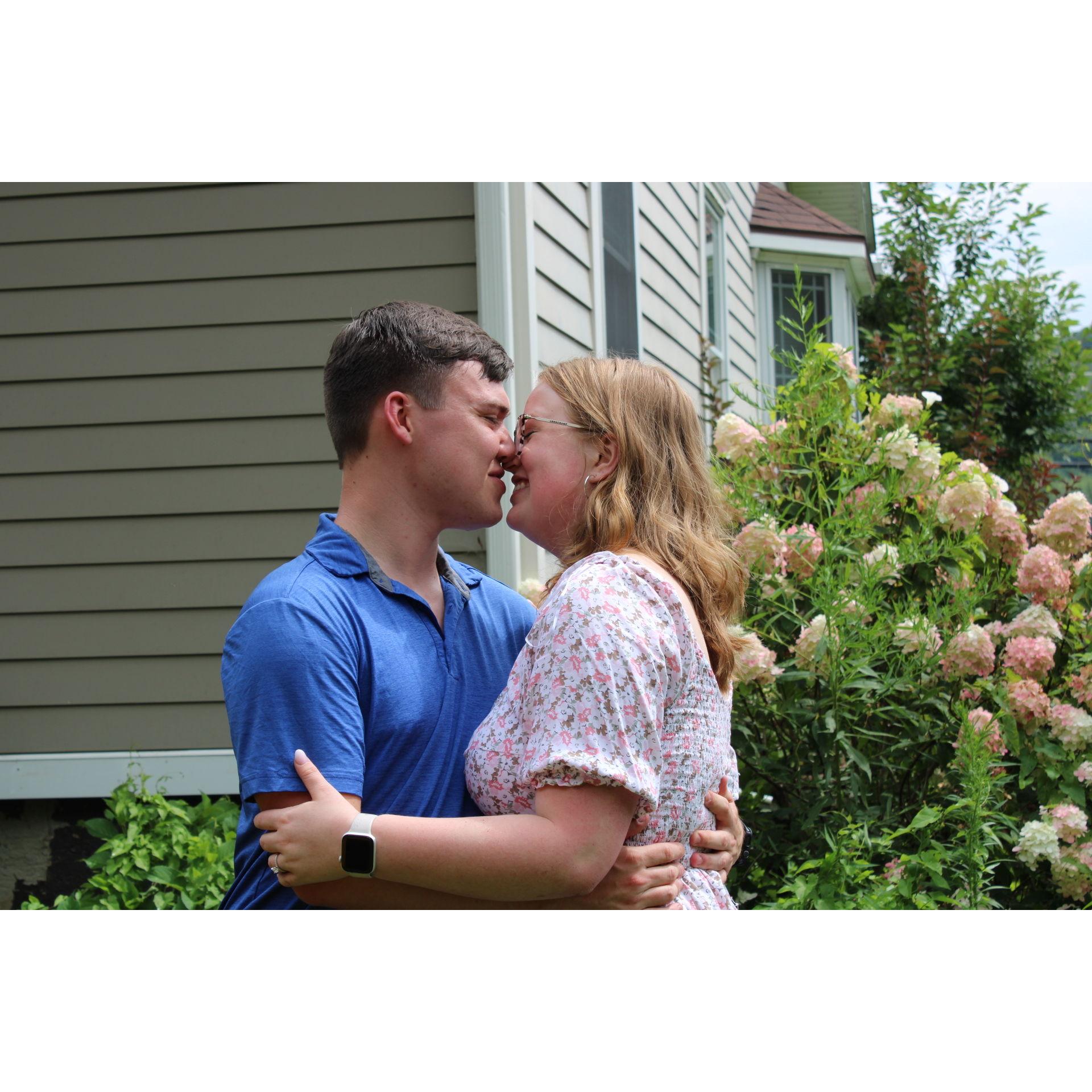 The happy couple sneaking a smooch
