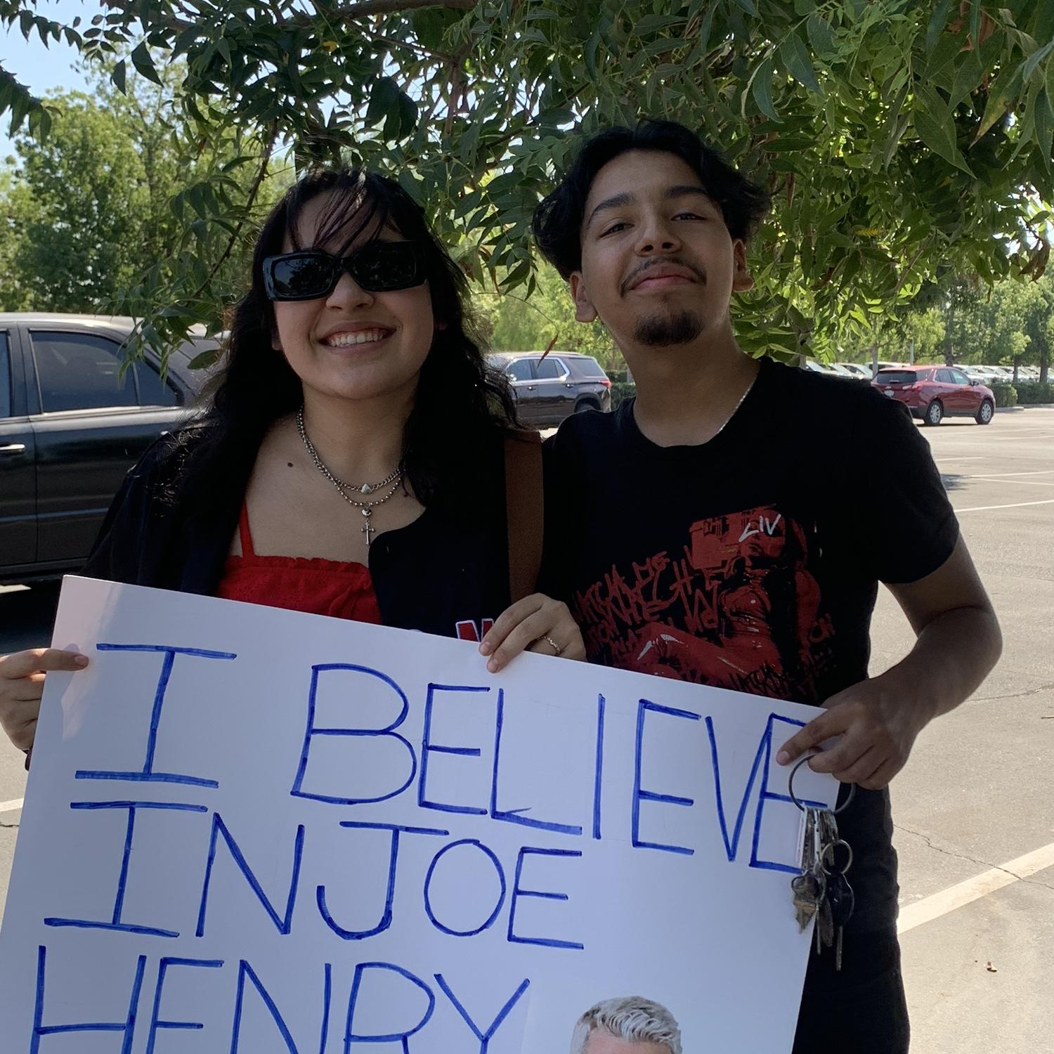 Us at a WWE show with a sign to put up