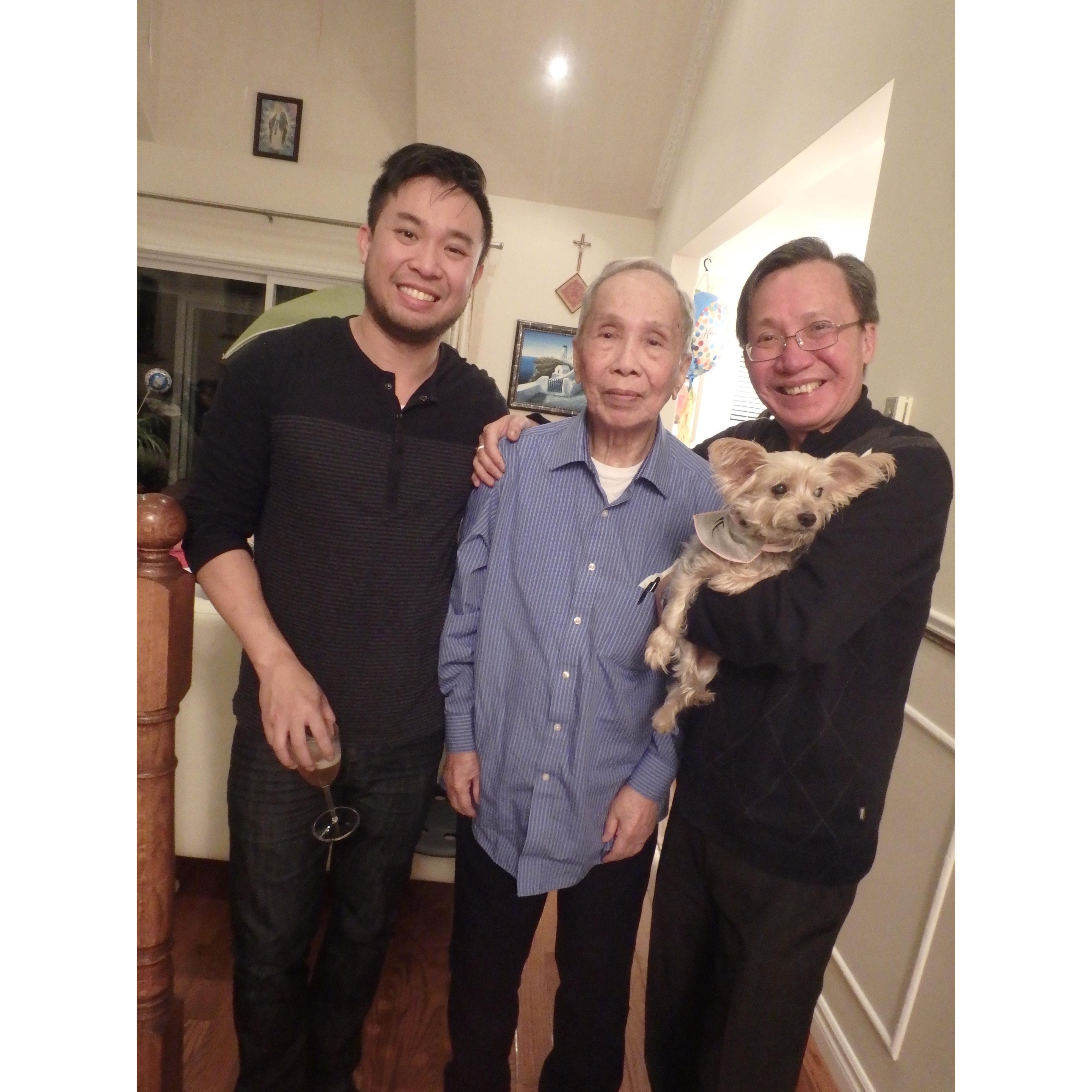 Three generations of Tong men with Emily at Christmas time.