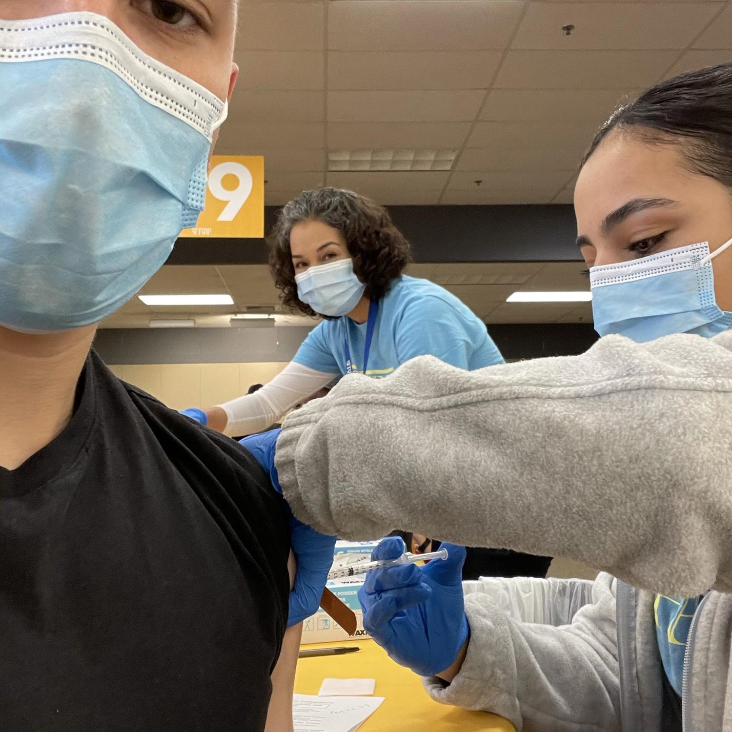 January 2021 Pau giving Albert his first COVID vaccine