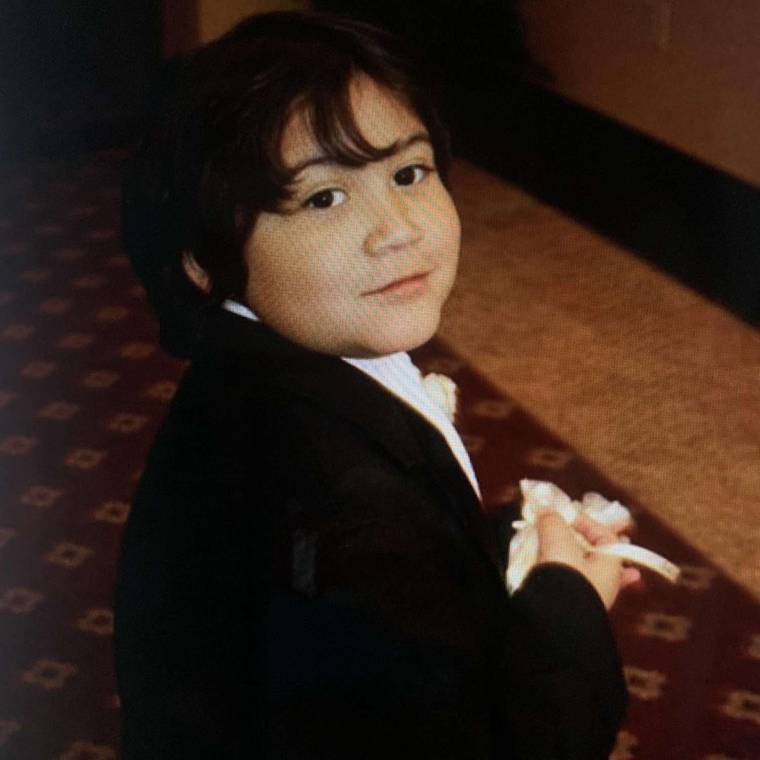 Iann as a ring bearer in a wedding