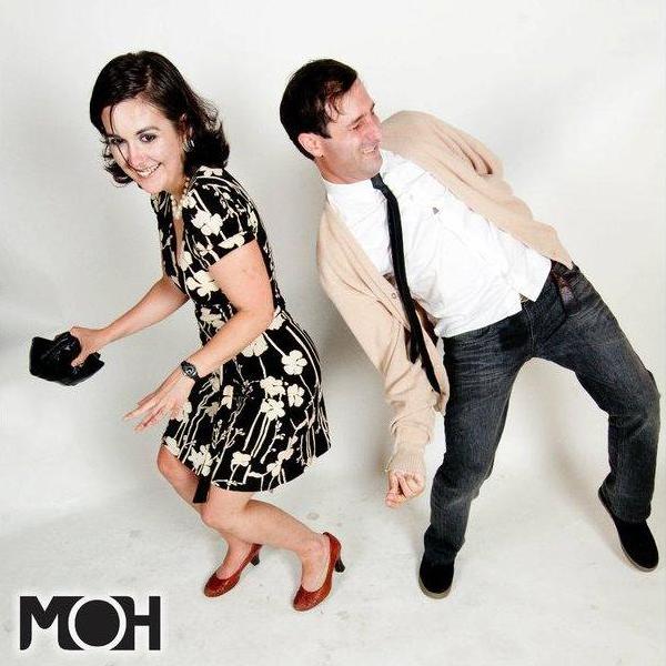I'm not sure if this is our first date or our third date, but it's us at a formal dance with all the local rock stars doing 50's covers.