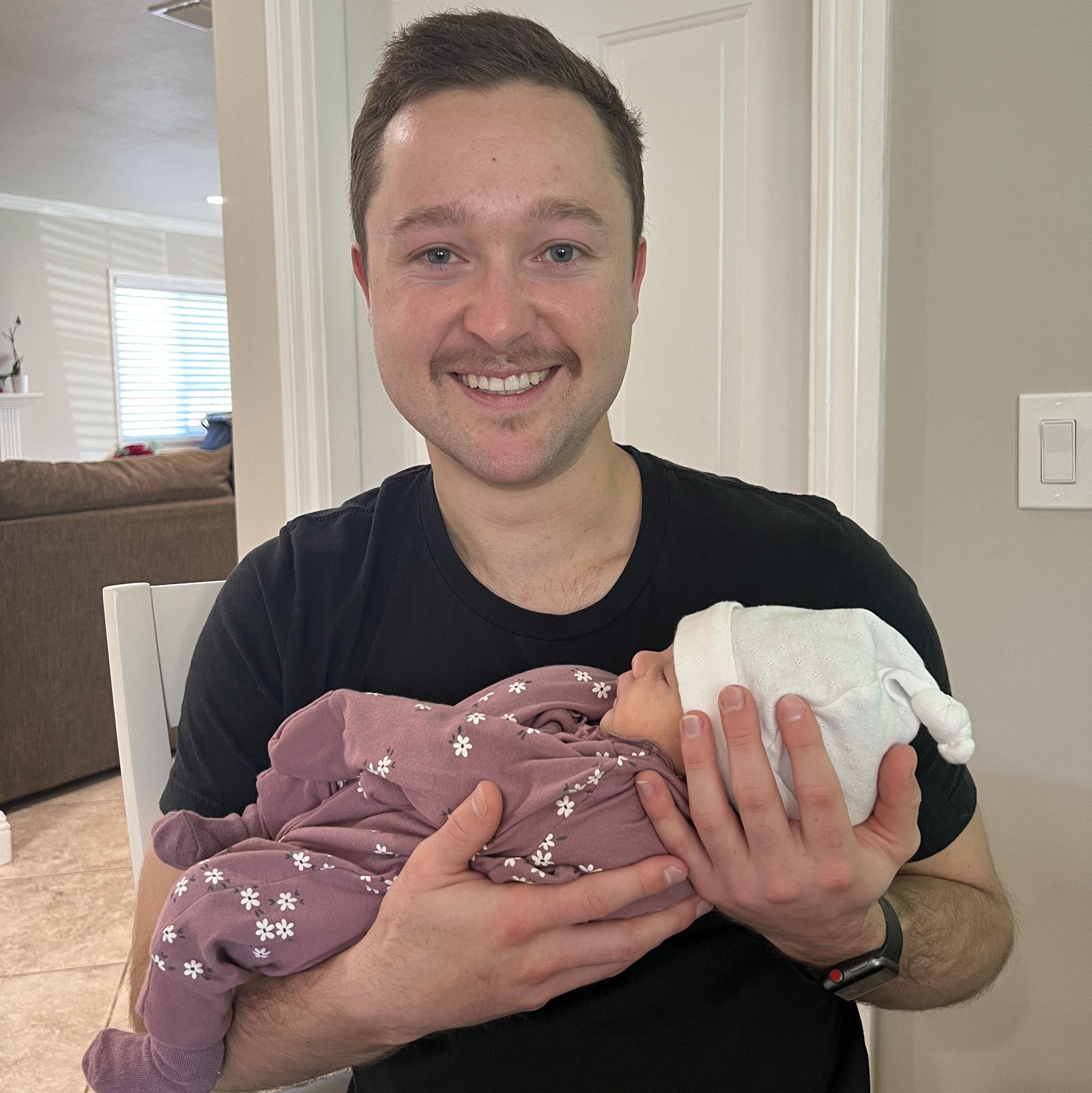 Trevor holding our niece Zoe for the first time.