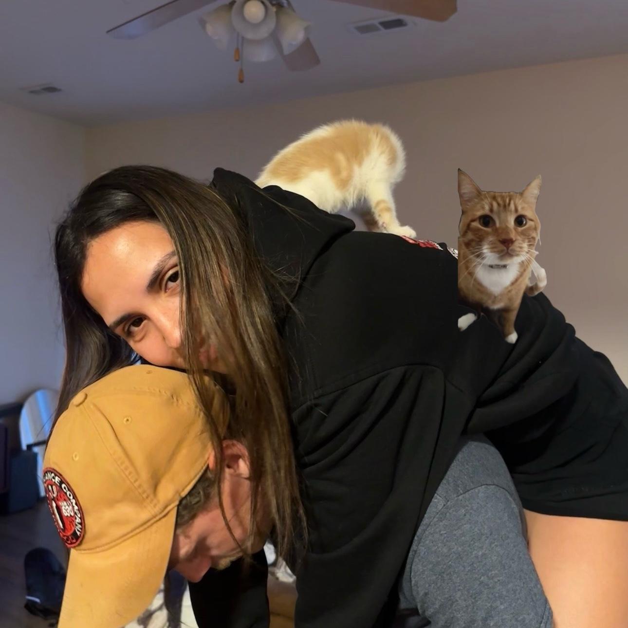 The day after we moved into our first house together. Our newest addition jinx was on my back so I had to photoshop a picture of my first baby Boots to also be on my back.