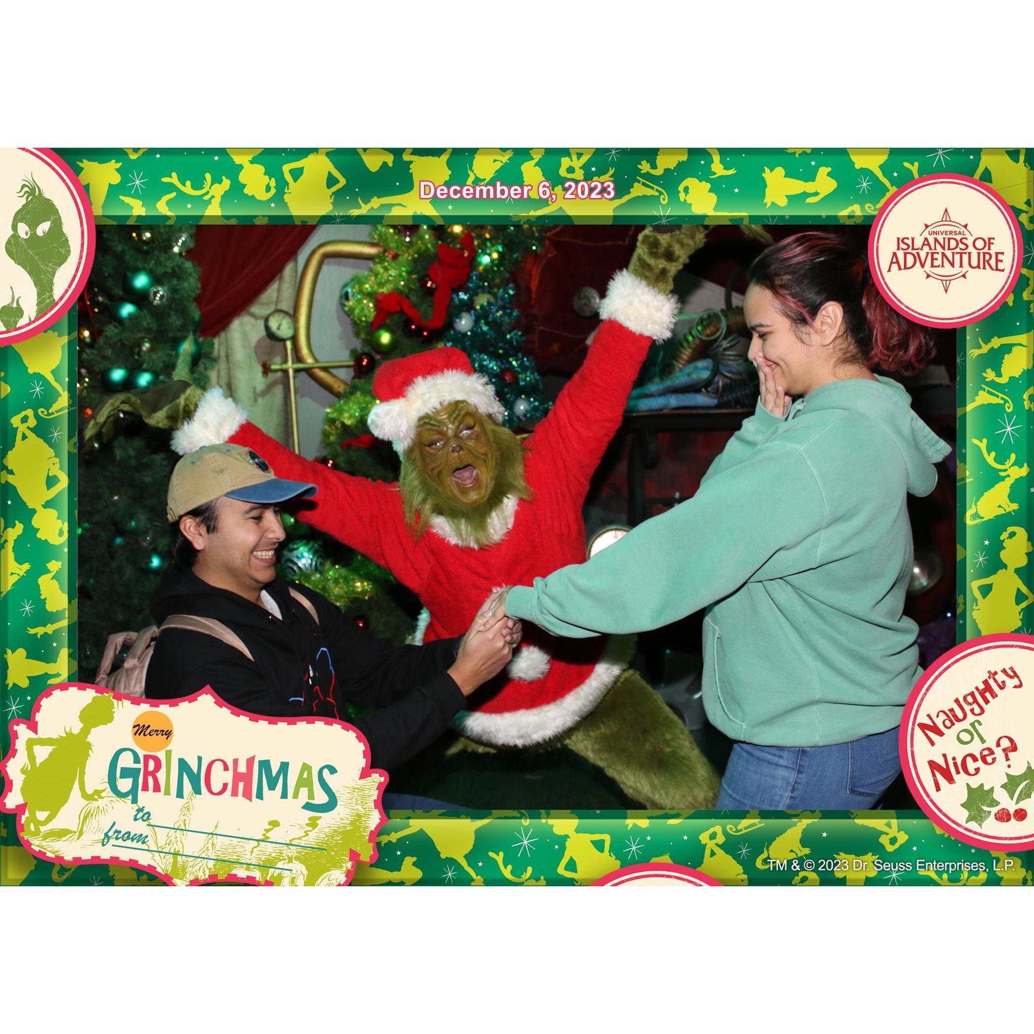 At our Universal 2024 Vacation, we waited hours to meet the grinch. When we finally met him, we told him that we just got married. He said we should re-enact the proposal with him. Pretty cool guy