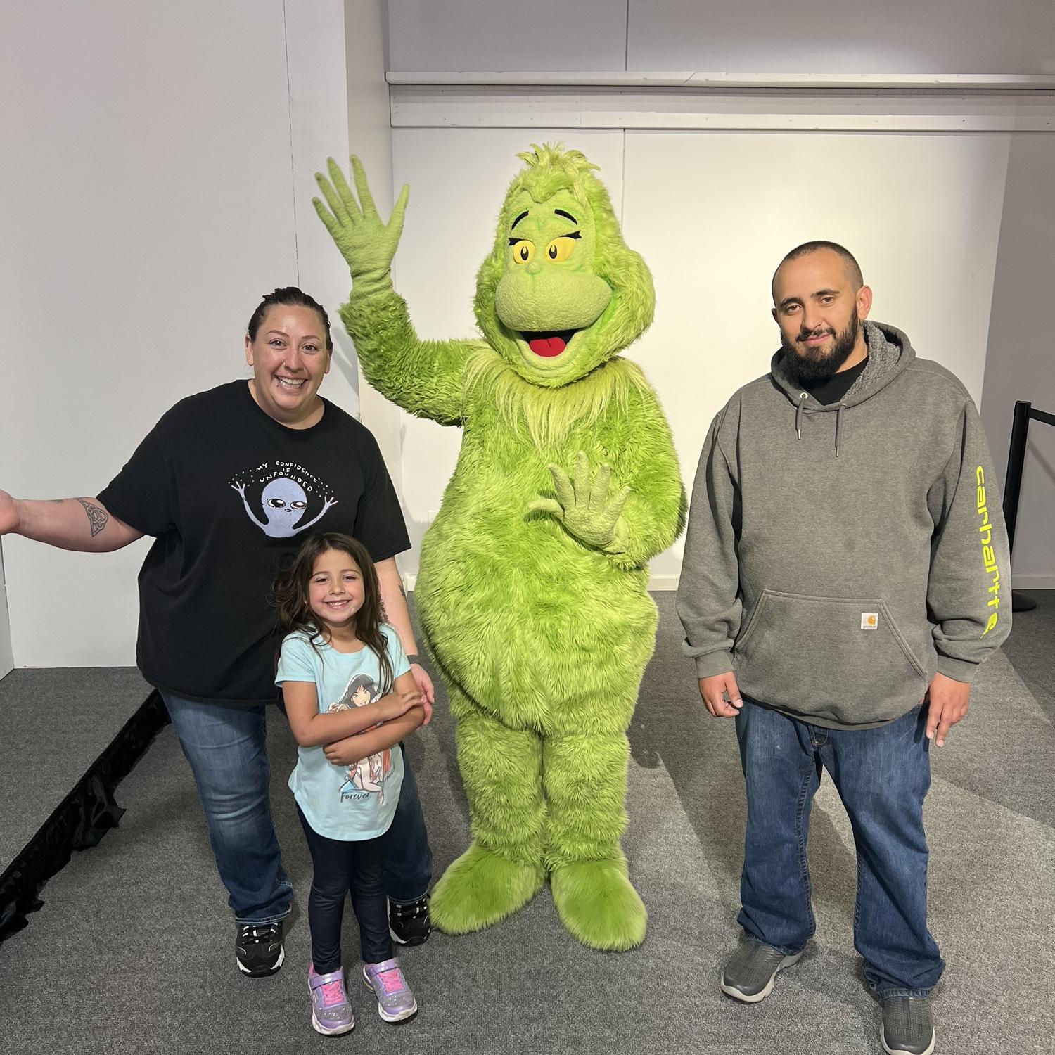 Meeting the Grinch at the Dr. Seuss Experience in Denver, CO.