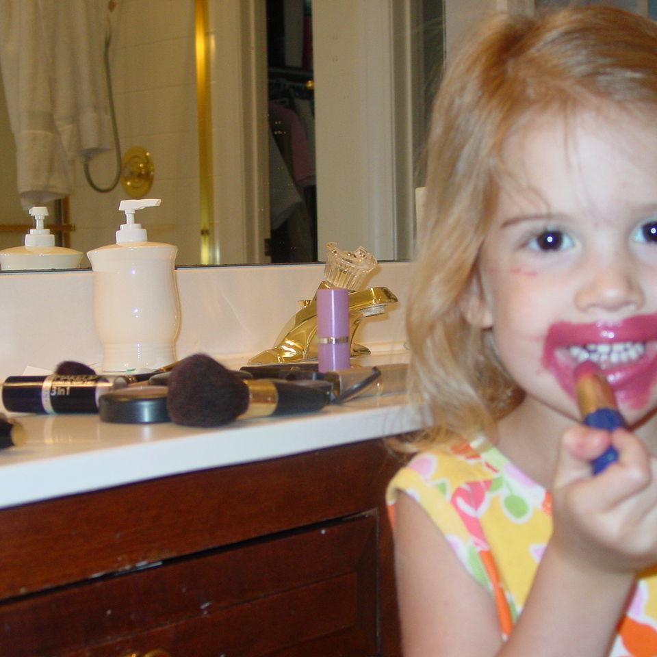 Margo applying her own makeup.