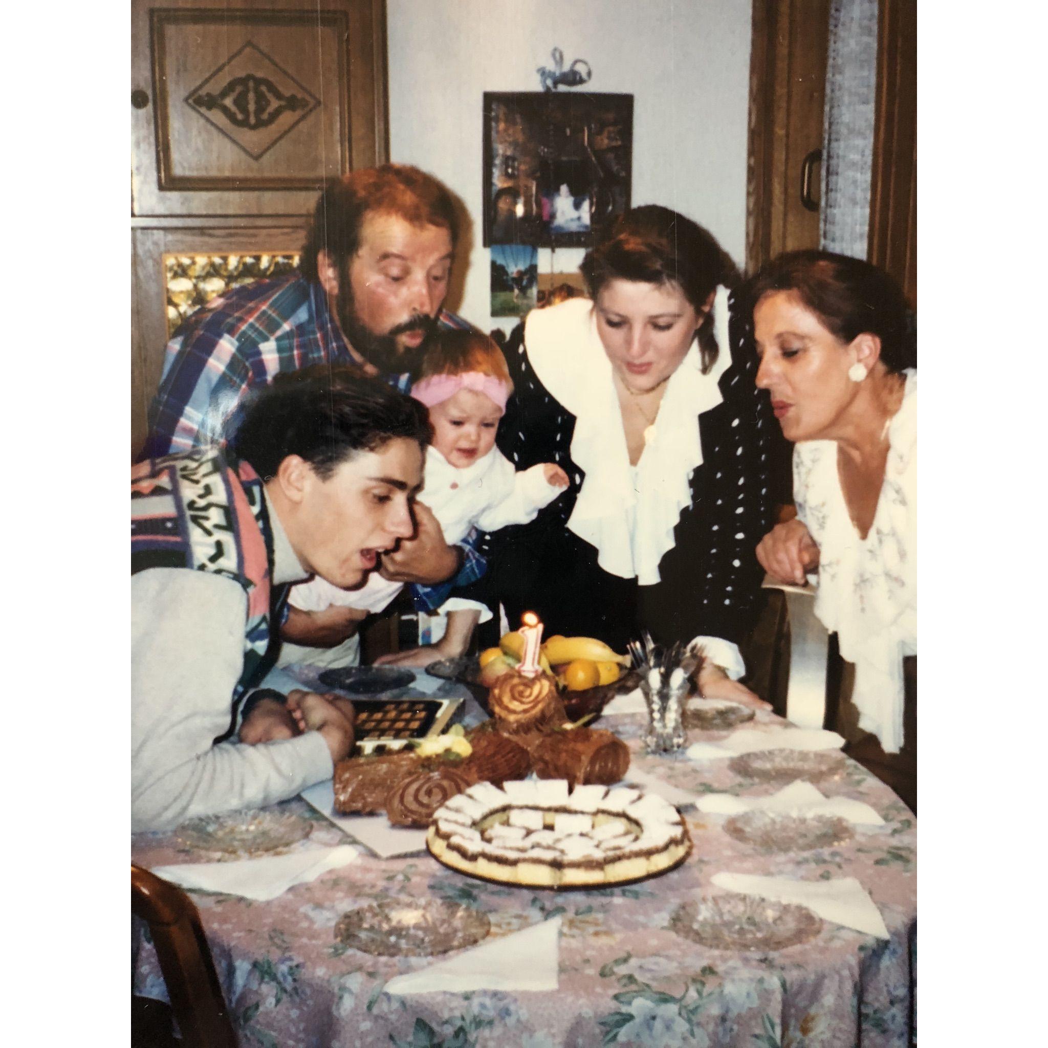 Baby Nicole with her mom and family