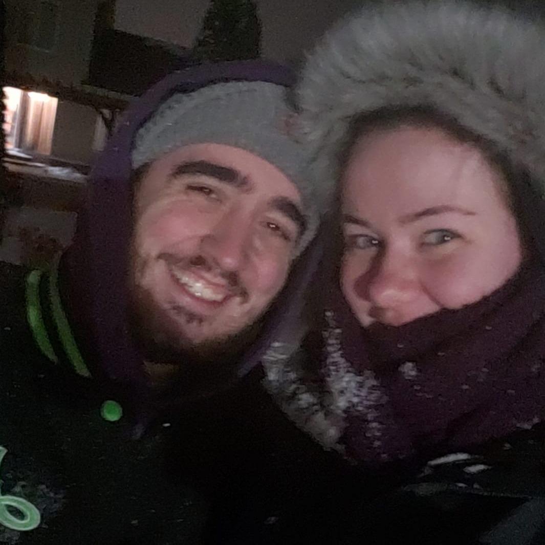 Enjoying a snowball fight at home.