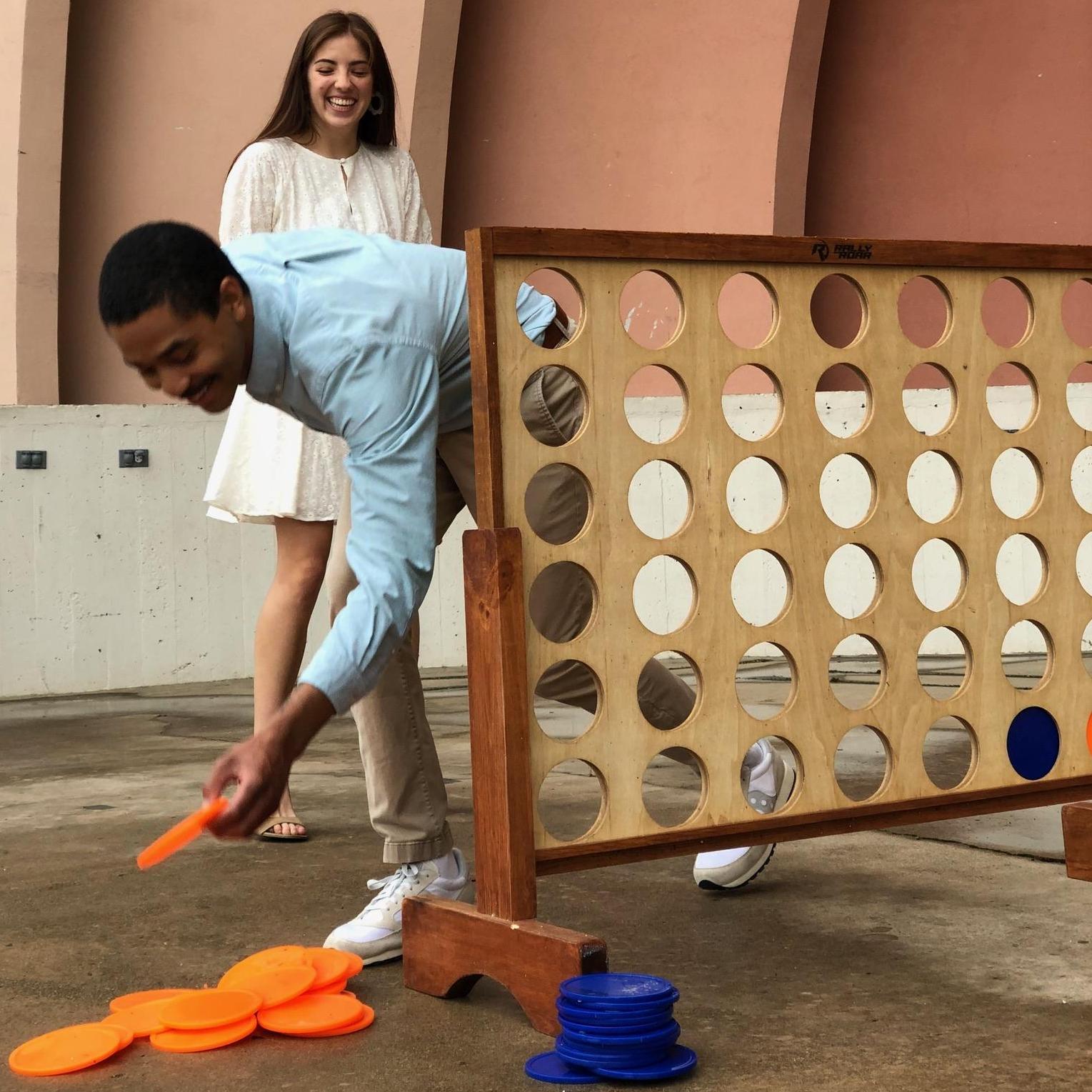 We stumbled upon a giant connect four set while trespassing on Texas State Fair grounds for our engagement photos. It's a funny story, really.