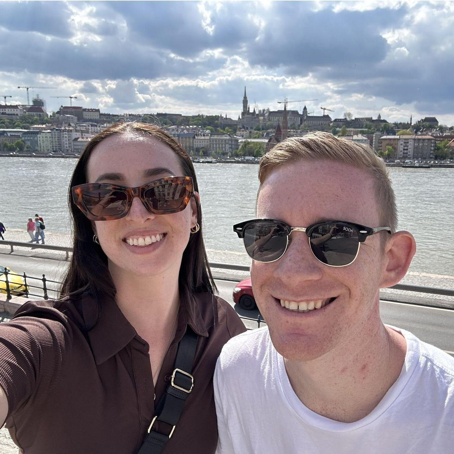 Hours before we got engaged! Visiting the Hungarian Parliament building with Fishermans Bastion (our engagement spot) in the background.