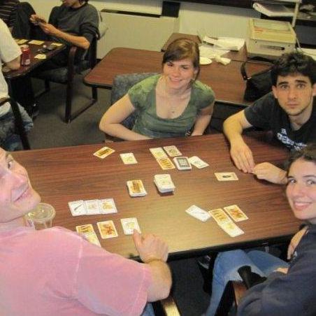 At Binghamton Gaming Group. Katty sat next to Leo and he taught her to play Bang! (hidden role card game).