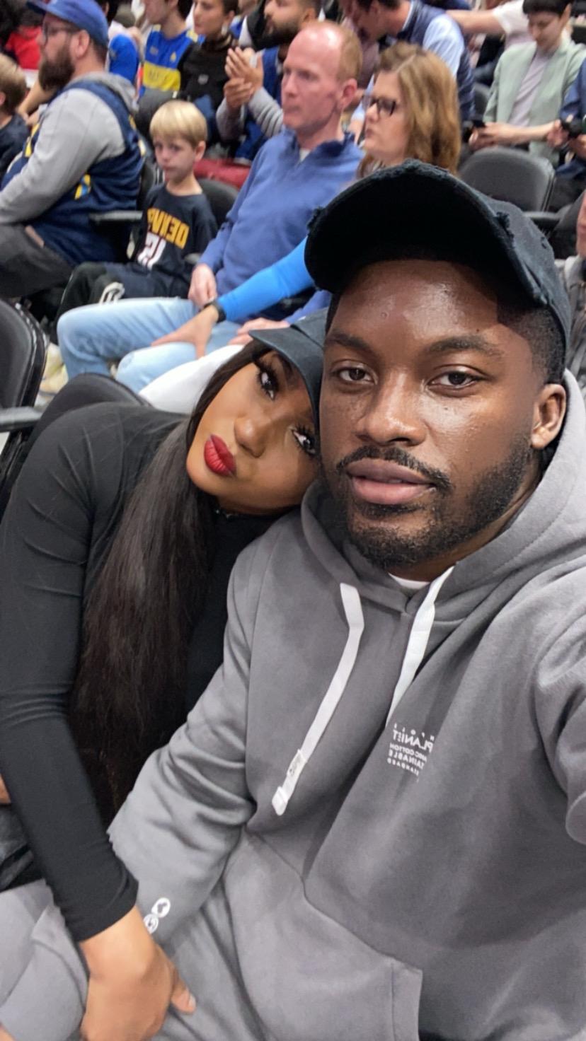 At a Wizards basketball game! One of our favorite things to do together. The bride loves leaning her head on her groom! ☺️