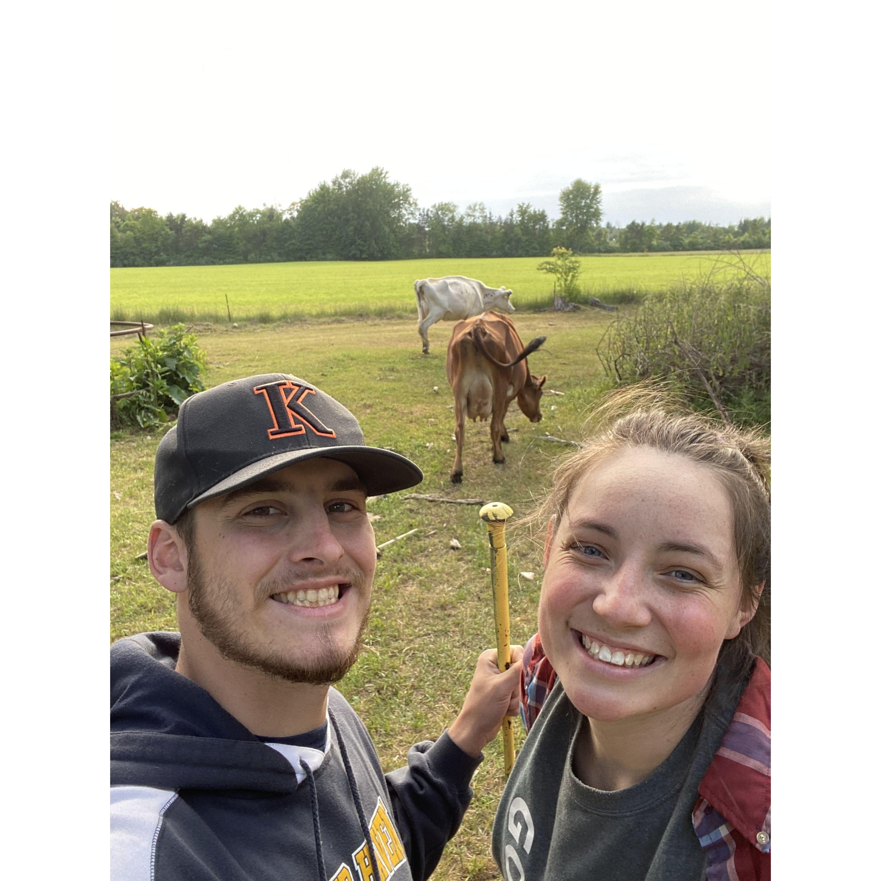 Kelly teaching Scott the ropes of farming.