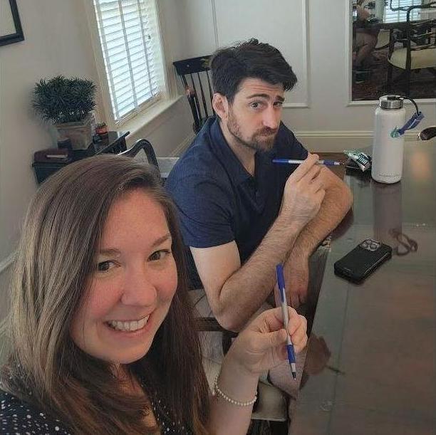 Action shot of getting our pens ready to sign closing forms for our new house!