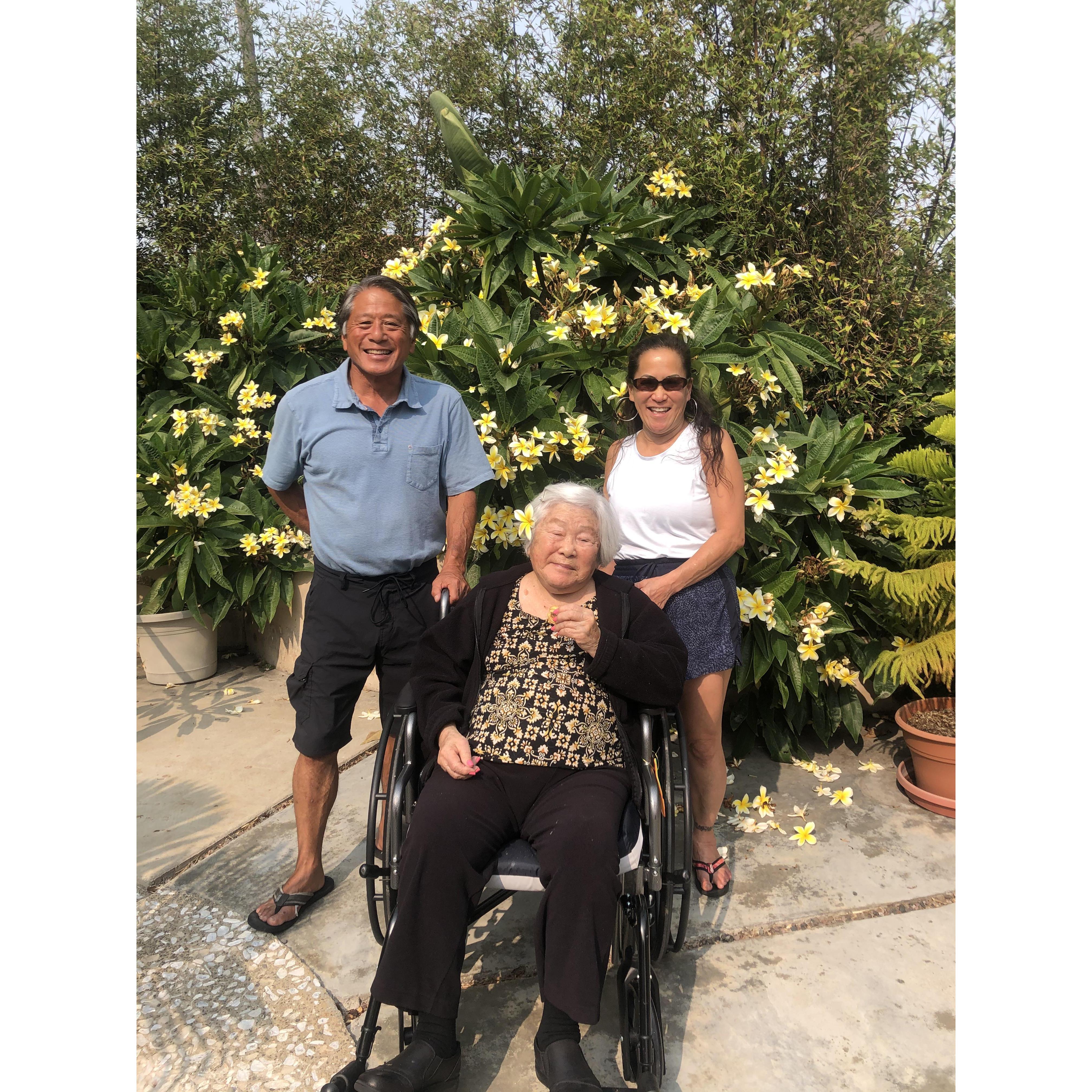 Tutu would regularly come over for lunch and enjoy Stan's plumeria and sun with Stan, Kelly, Kalia, and Melia