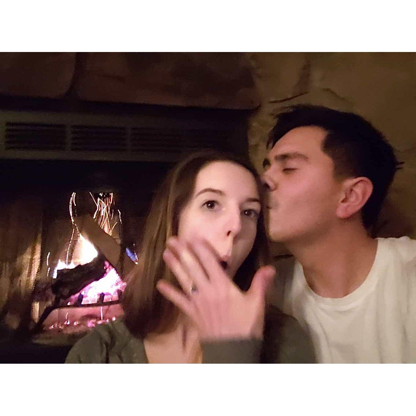 Newly engaged in front of the fire- Pedro's favorite photo, Brooklyn's least favorite