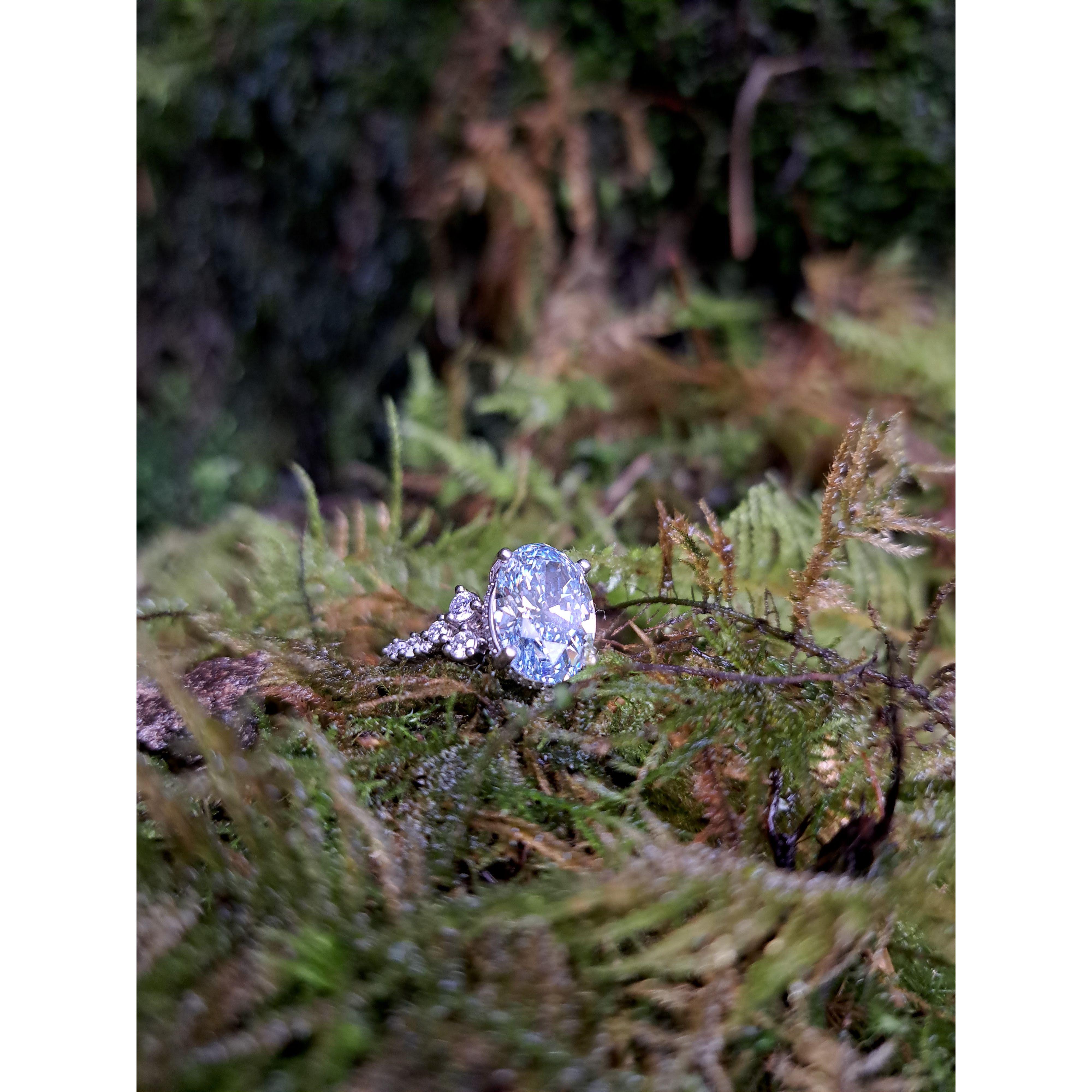 My engagement ring! Nick and I got to custom design it. The center stone is a blue diamond to match Nick's eyes, and Nicks ring will have green diamonds to match mine!