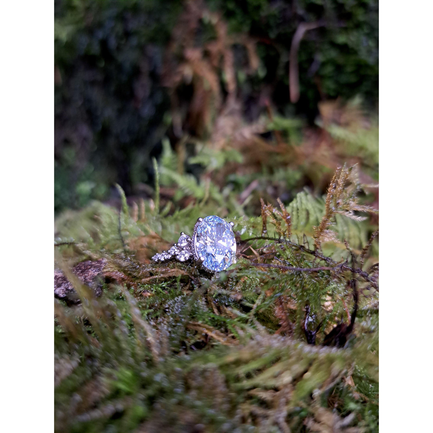 My engagement ring! Nick and I got to custom design it. The center stone is a blue diamond to match Nick's eyes, and Nicks ring will have green diamonds to match mine!