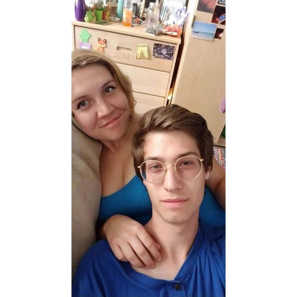 In the love seat of Miranda's college dorm room