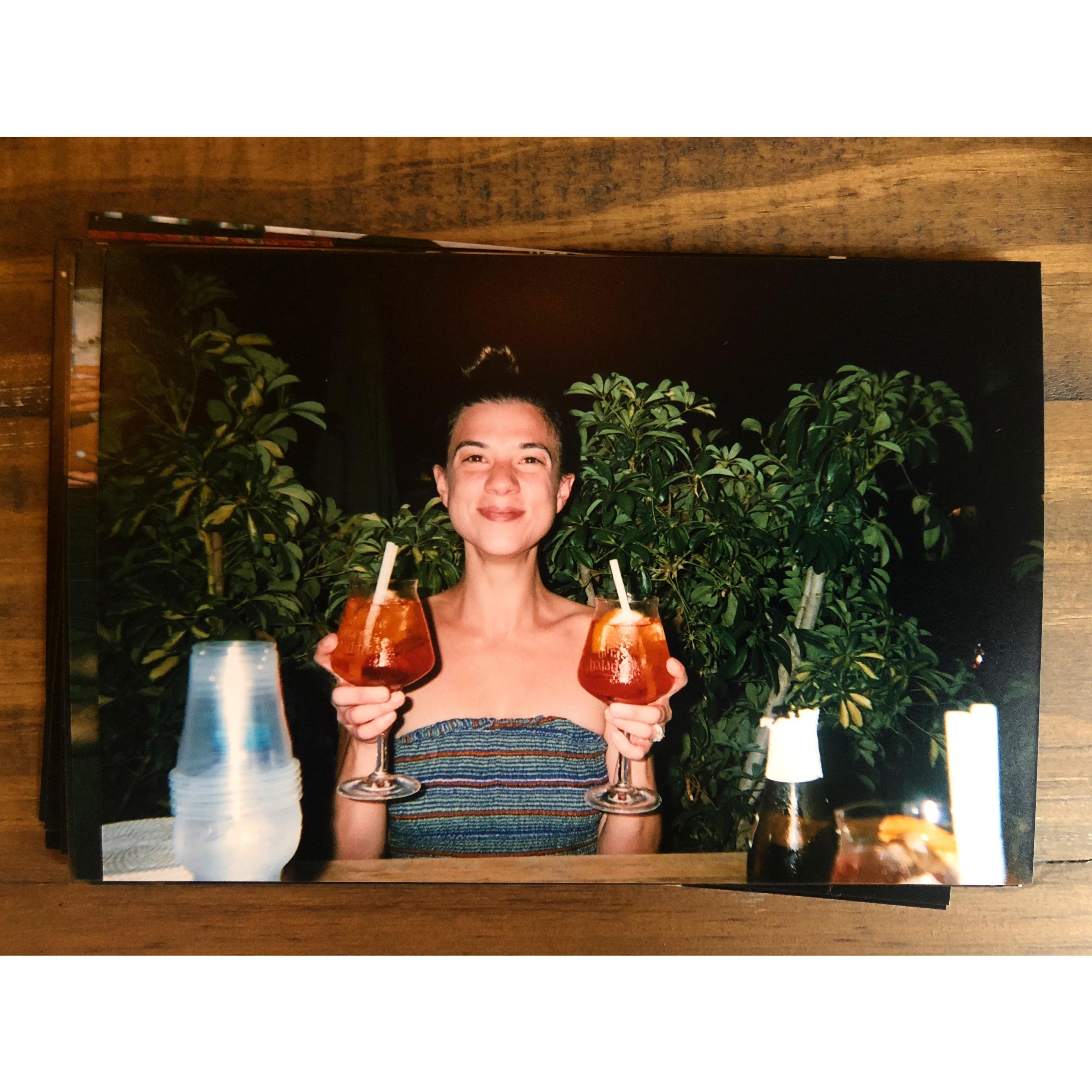 Lianna enjoying her favorite Italian cocktail, the "aperol spritz"