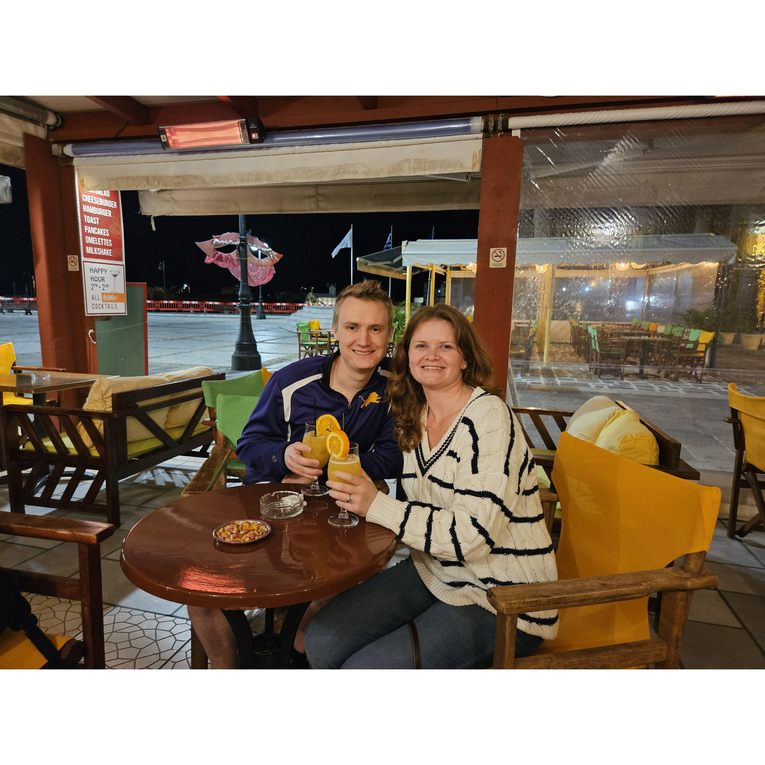 A waiter took this picture of us newly engaged and enjoying the punniest cocktails they served!