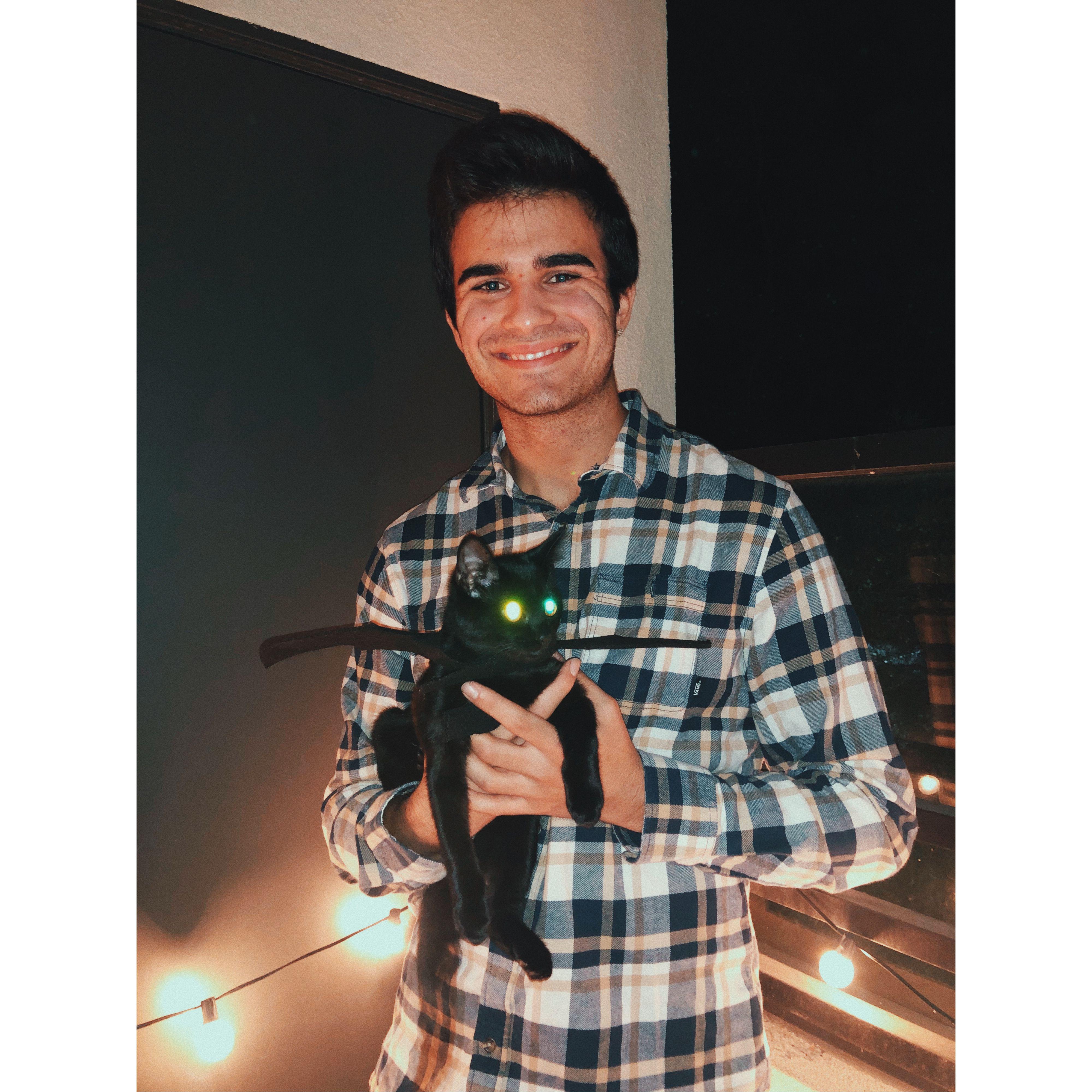 Eli with our kitty Olive on Halloween.