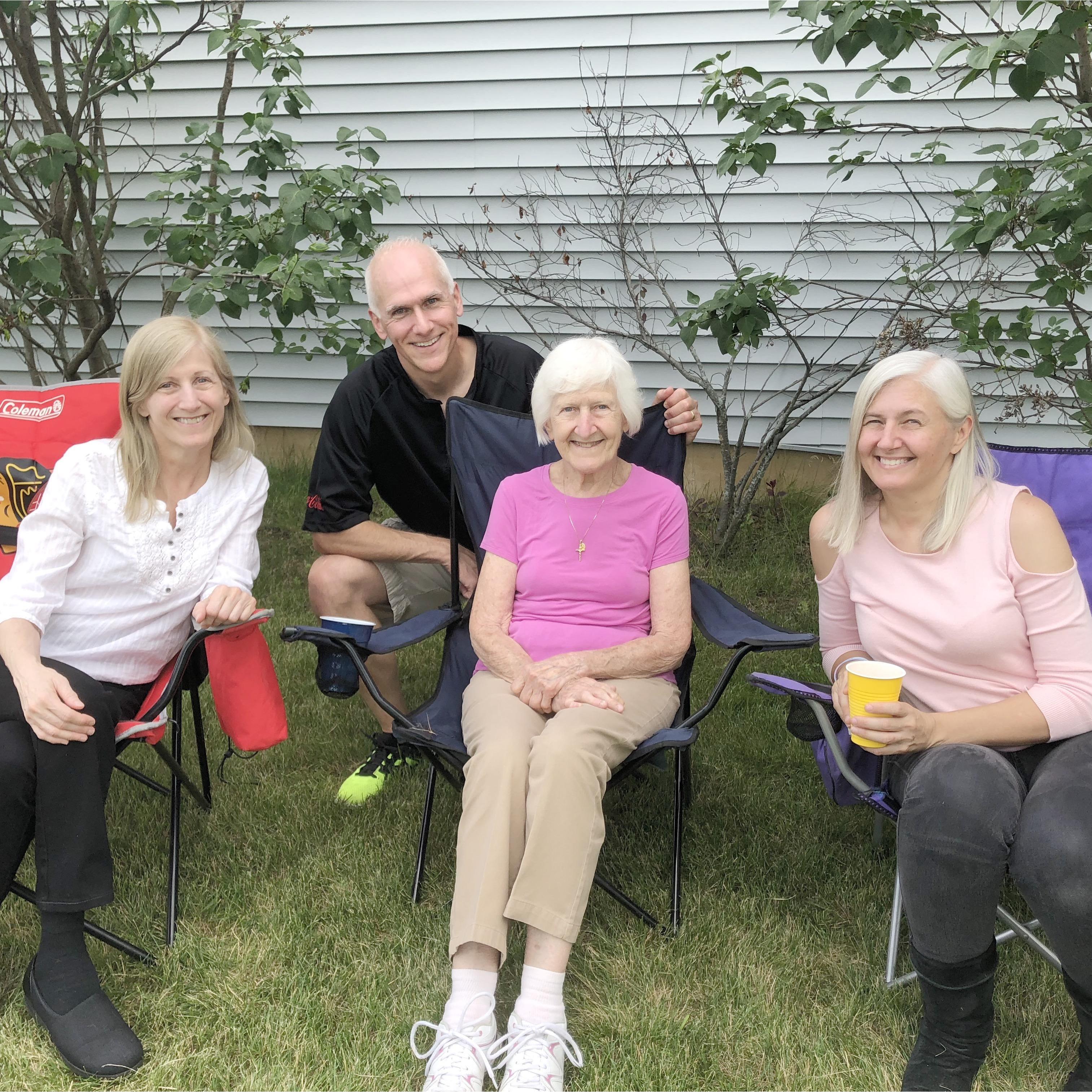 Three of the five Brokaw children and their mom; Robin, Dan, Grandma, and Julie at a summertime celebration at Uncle Dan and Aunt Sarah's house.