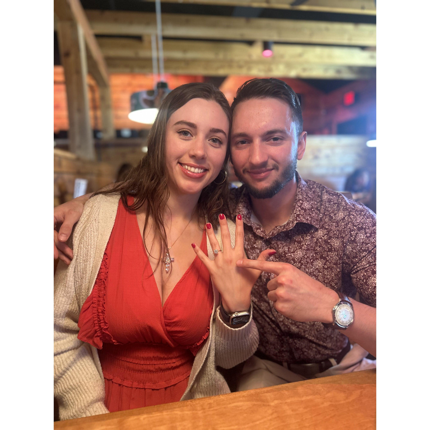 Celebrating the proposal with my parents at Texas Roadhouse