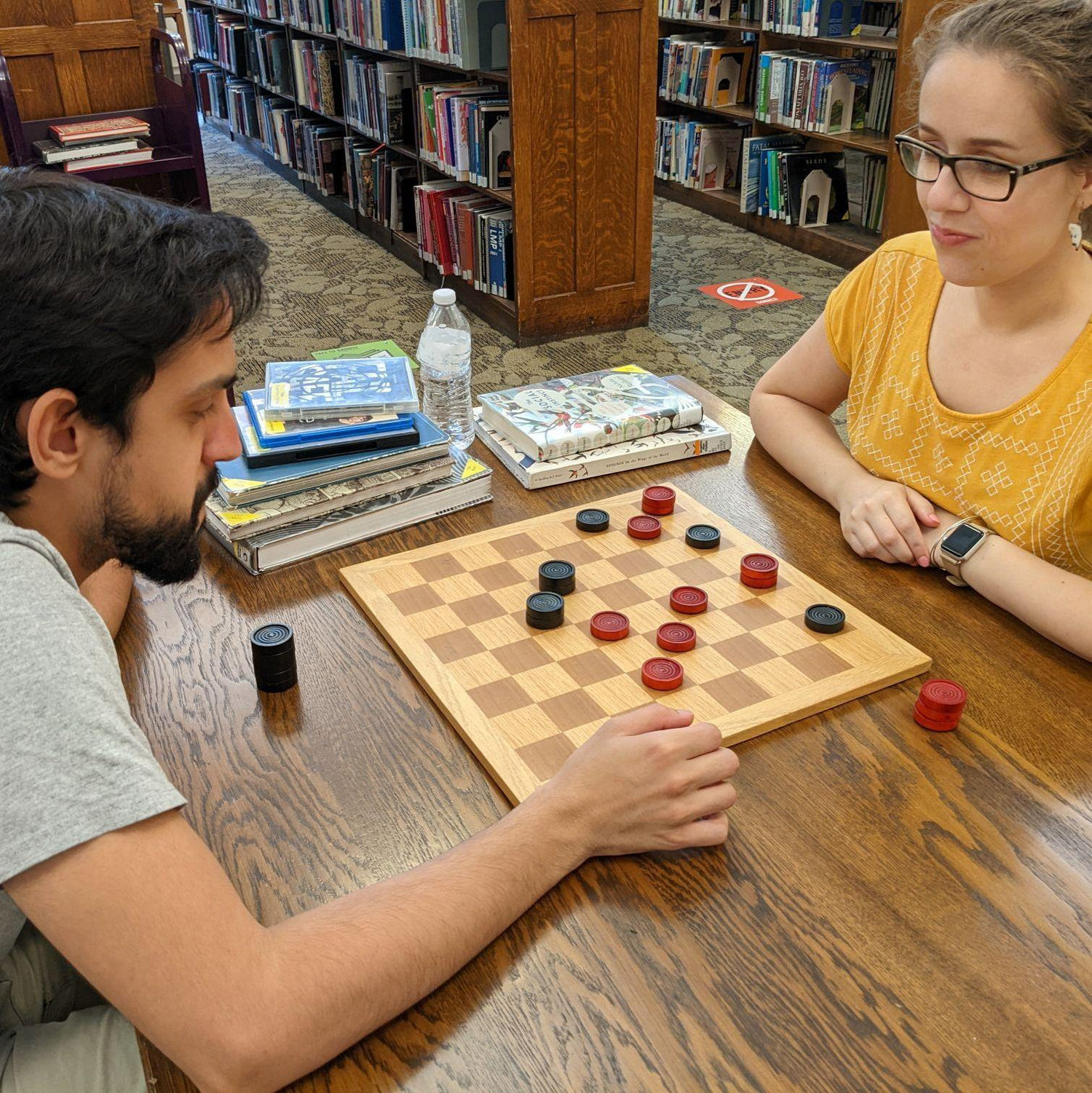 Monica taking it easy on Ralph in checkers