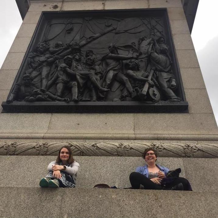 Sarah and Zoe sit on the steps of Nelson's Column, London, June 2017.