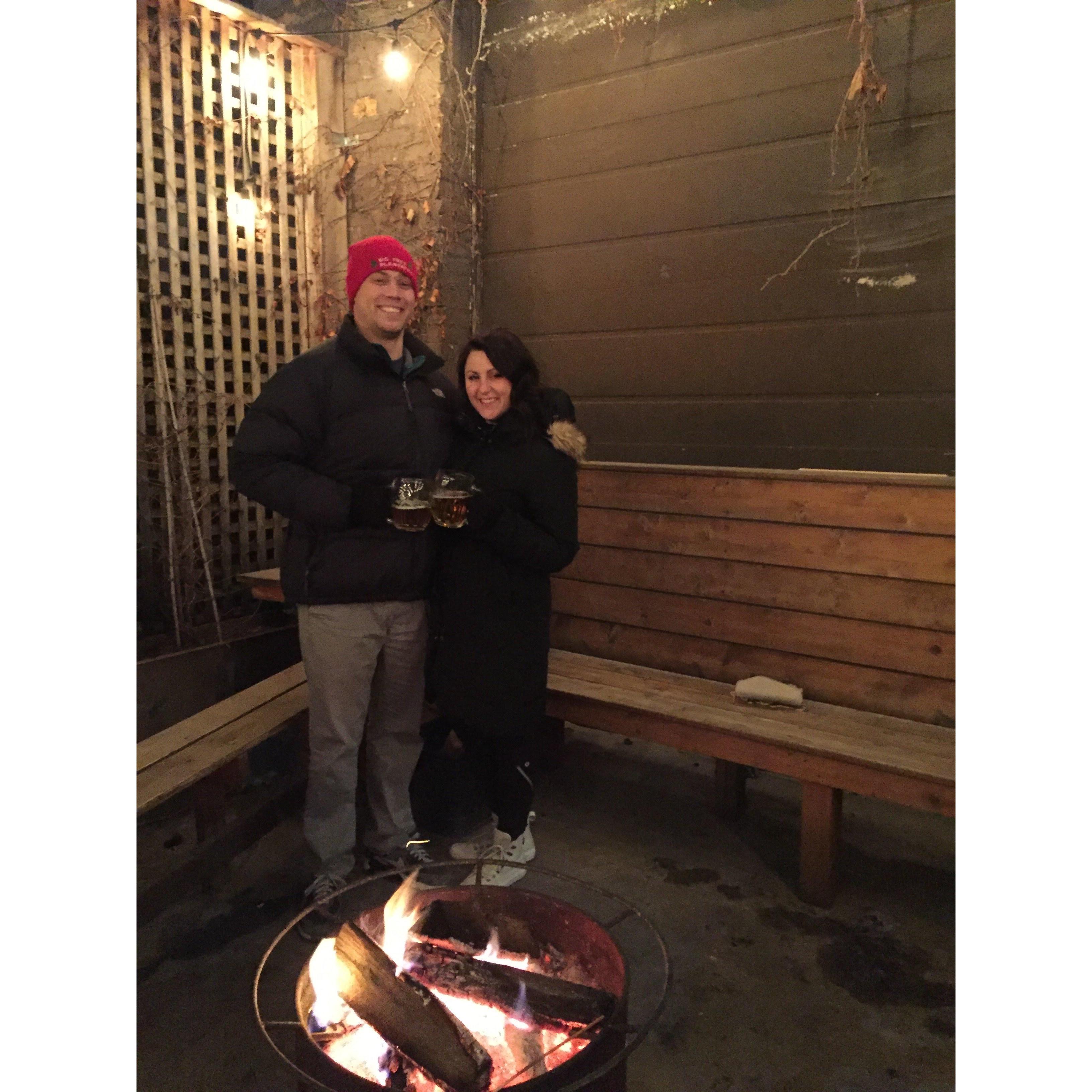 Warming up by the fire post curling match at Kaiser Tiger