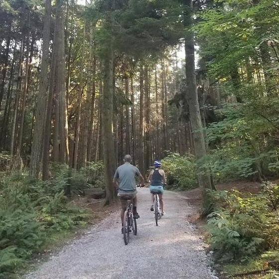 At Stanley Park in Vancouver, BC. One of the only times we have biked together on compatible bikes.