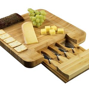 Bamboo Cheese Board and Cutlery Set, Meat and Charcuterie Wood Serving Tray with Slide-Out Drawer that holds 4 Stainless Steel Serving Knives and Utensils. Perfect for Cocktail Parties or as a Gift