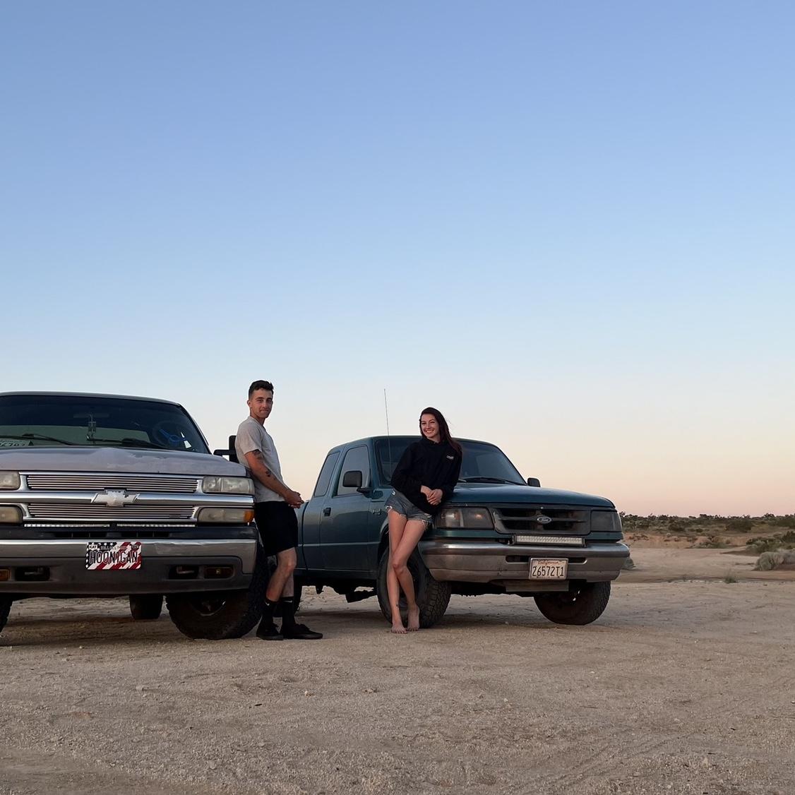 With our first trucks. His Chevy Dusty and my Ranger Bug