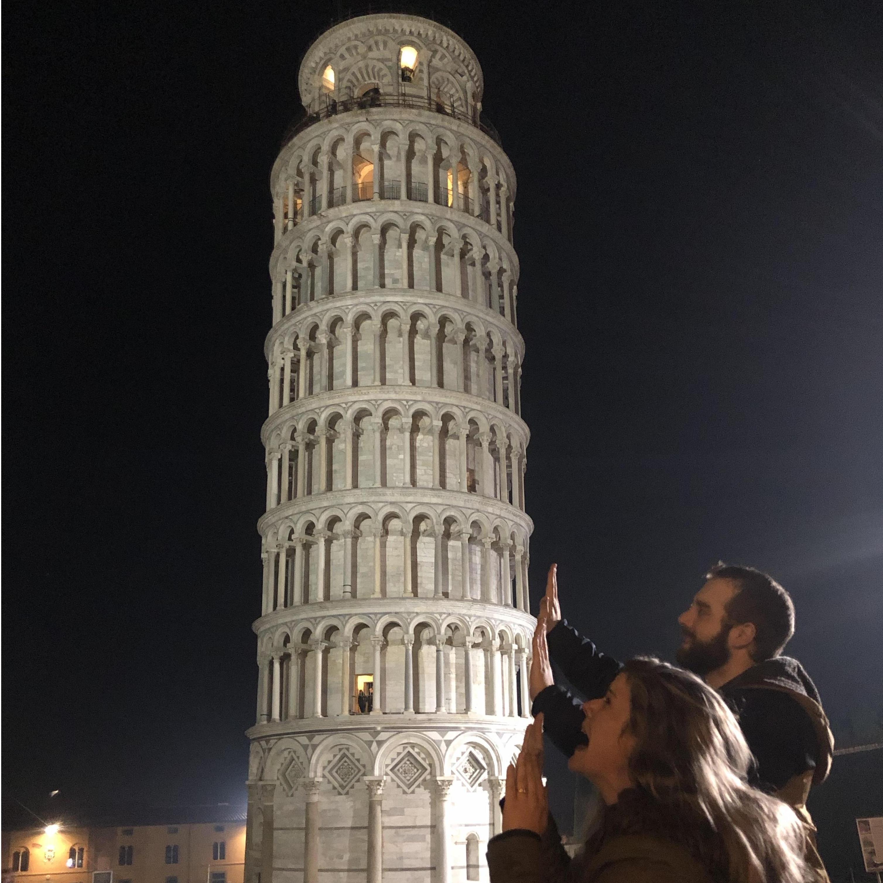 Trying [unsuccessfully] to hold Pisa up. December 2018.