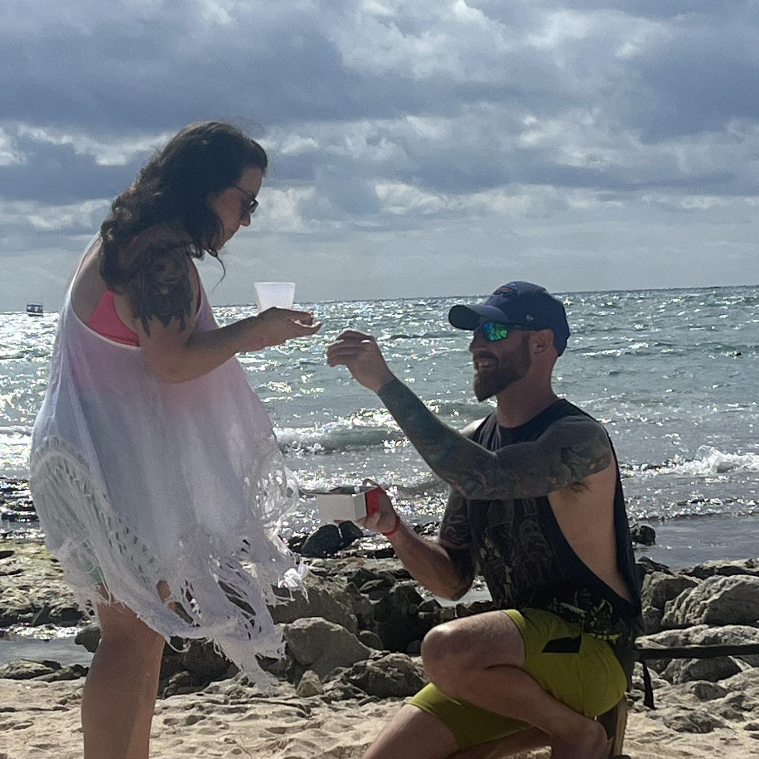 We were on the beach in Cancun, Mexico enjoying the morning with friends and Derrick called me over because he had found something in the sand...a RING!!