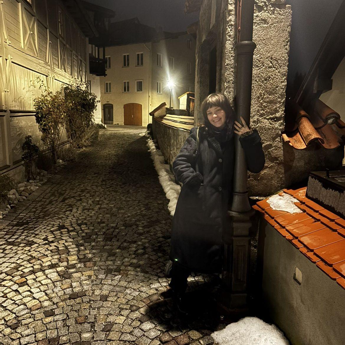 Morgan standing right where we got engaged under this lamppost in Fussen, Germany