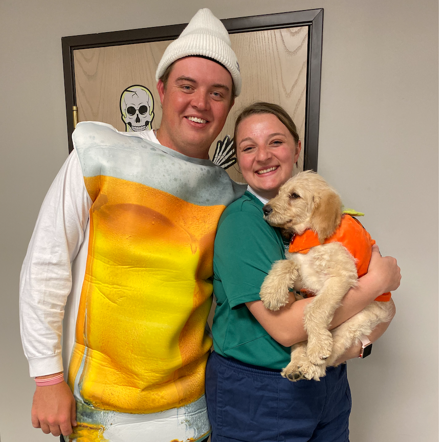 Our first family photo with Jeff at Sam's work Halloween party. A mug of beer, a rugby player, and a pumpkin!