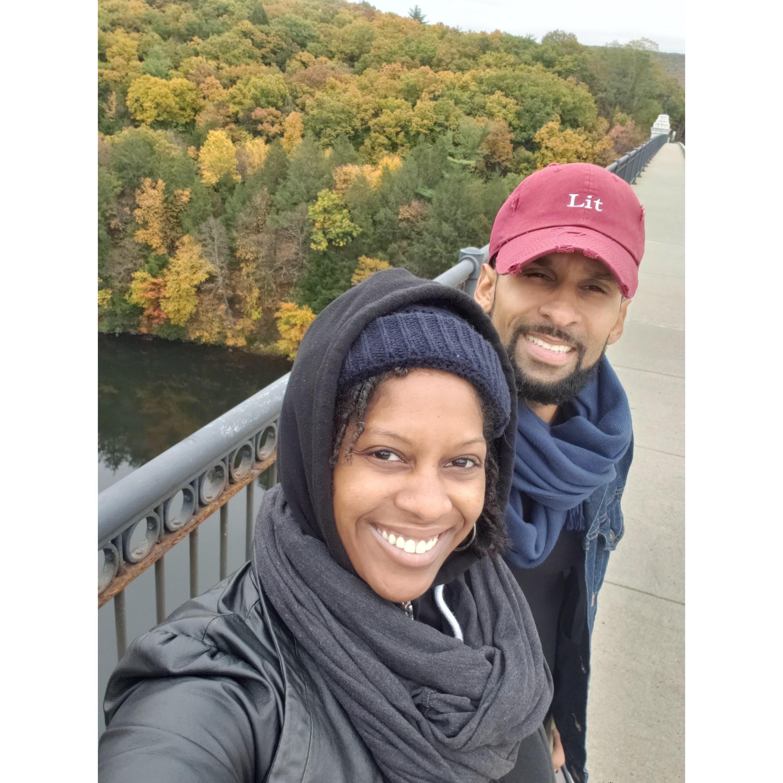 We travel well together and a lot! This is us on one of our favorite bridges in Massachusetts. Isn't the foliage beautiful?!