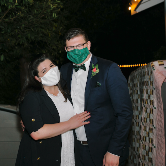 Steph's mask was made from the fabric of her mom Sandra's wedding dress that her mom--Lauretta Tanner--made (along with the quilt in the background)