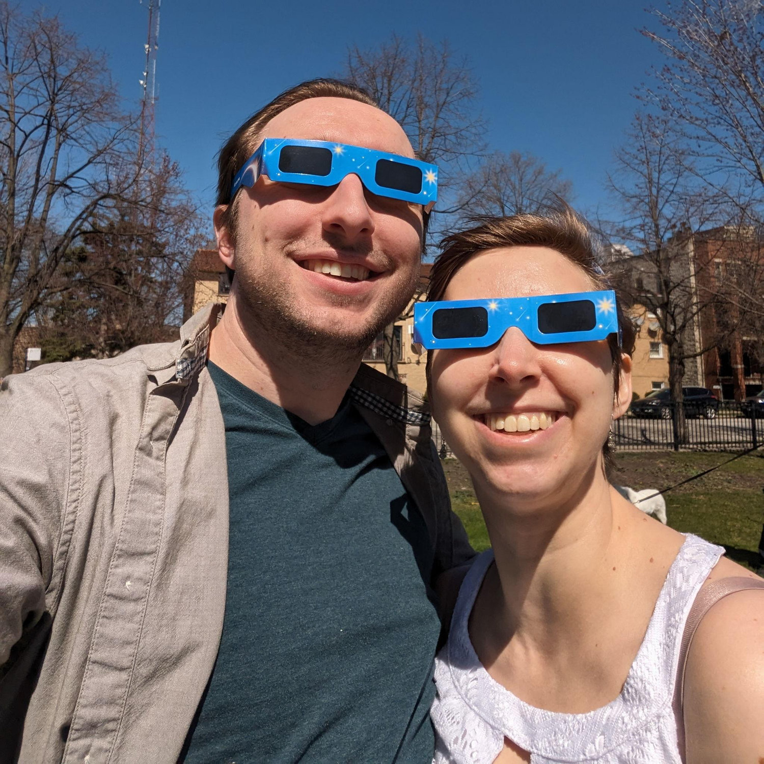 April 2024: Erin and Brian watch the solar eclipse together in Jefferson Park, Chicago.