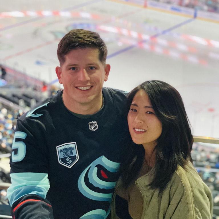 Our first photo as a couple - at the Kraken game in Seattle.