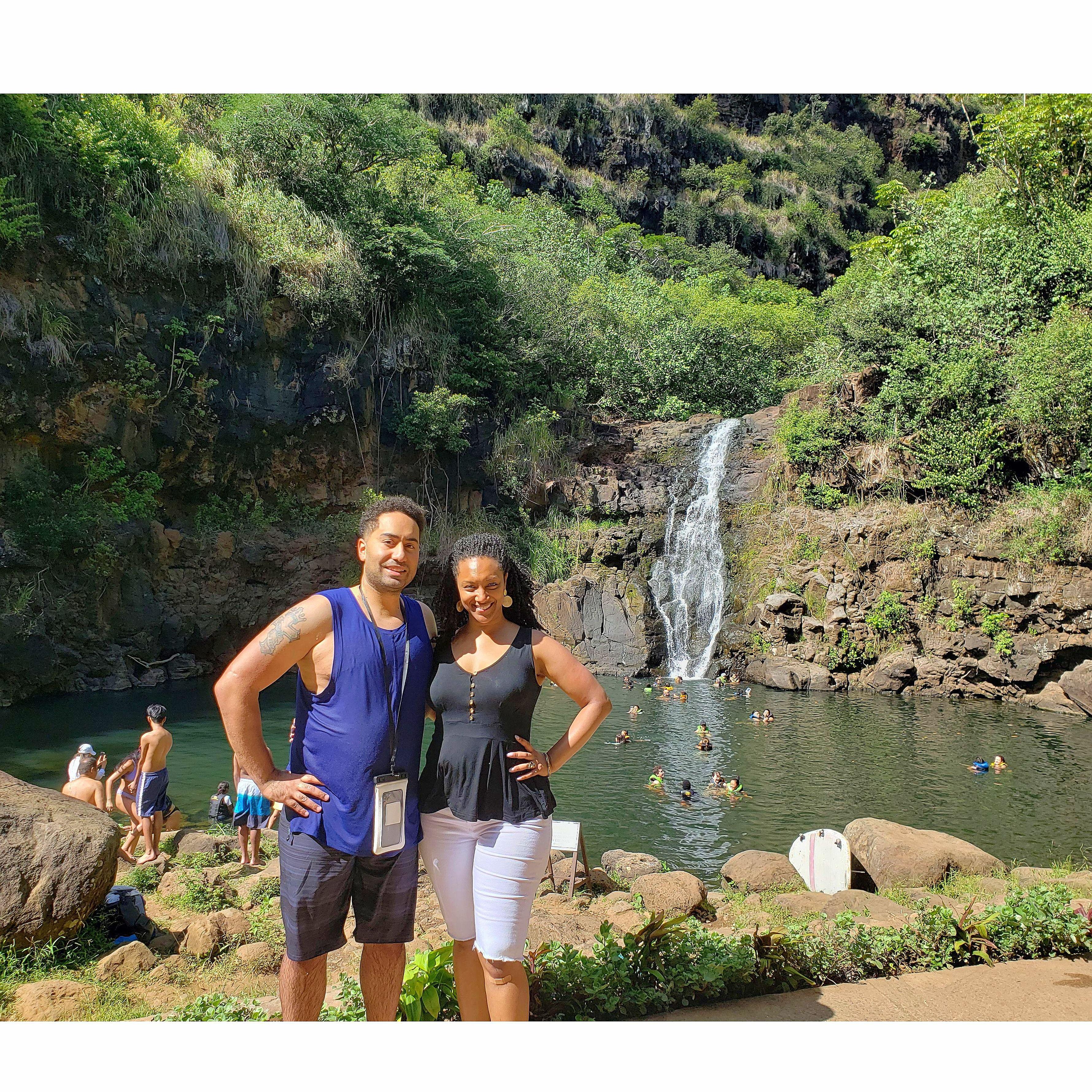 Posing in front of Waimeia Falls on Oahu before a dip in the water