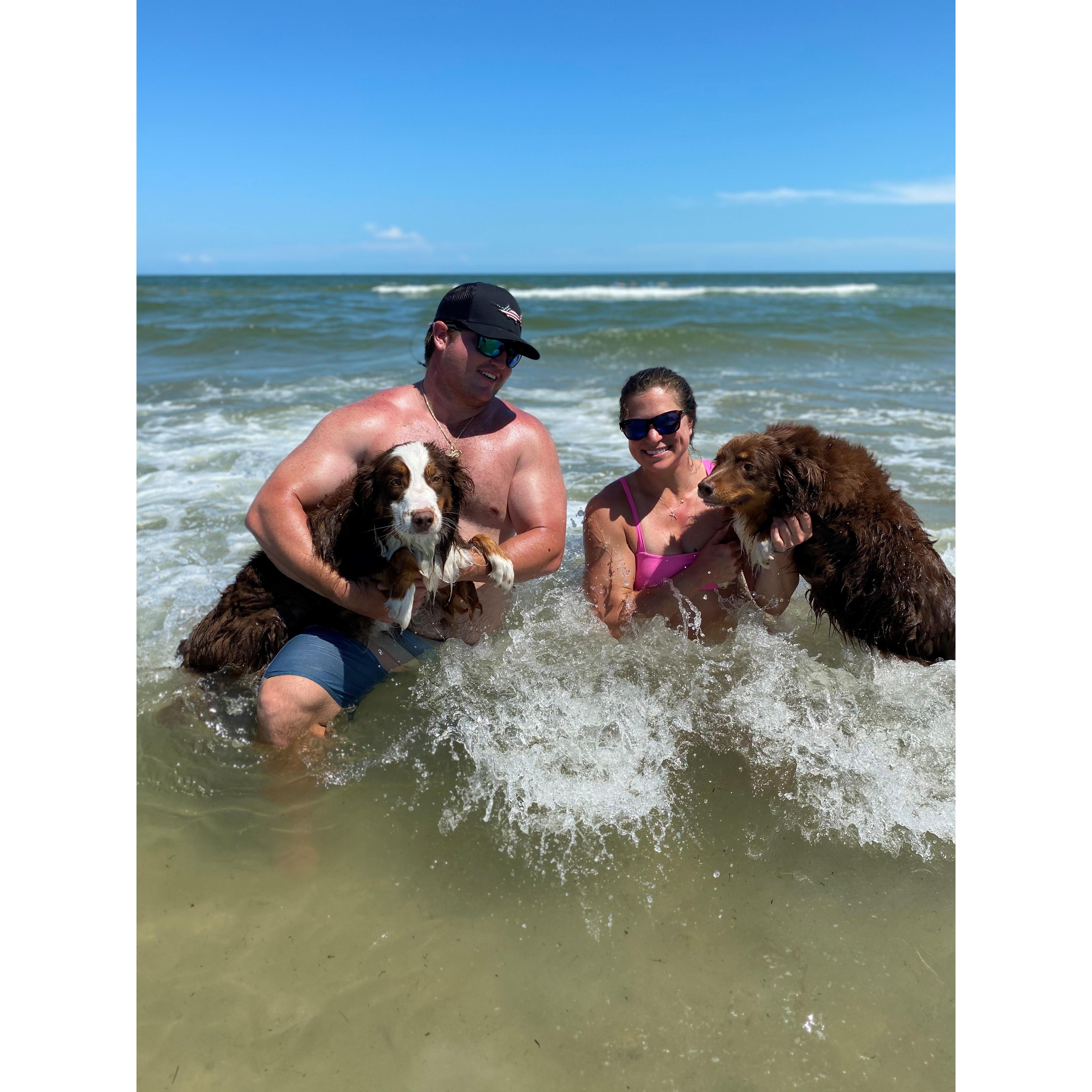 Posing with Taylor's dogs Trigger and Bulleit during the Fritz family 2020 Port A vacation.