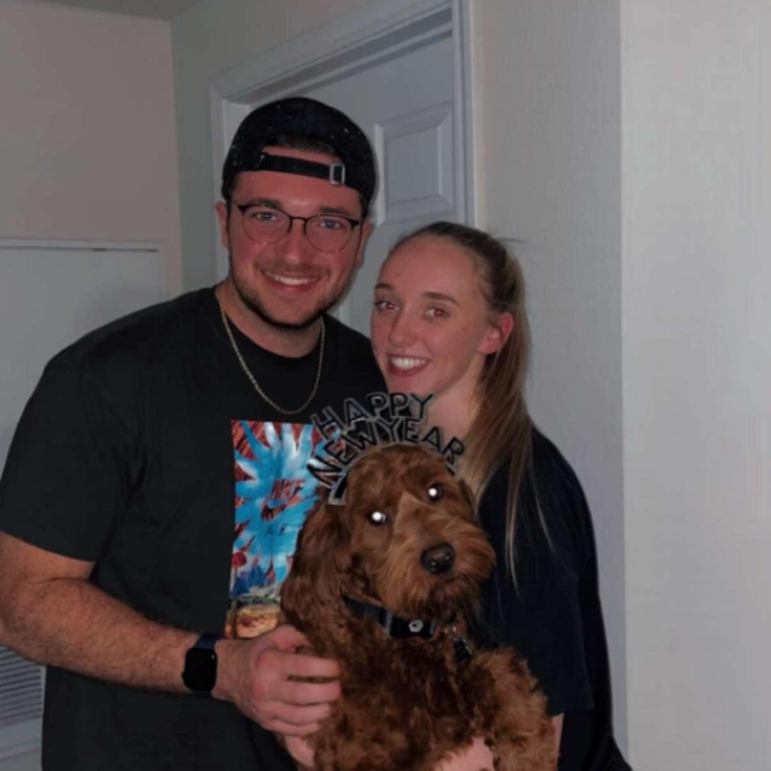 Nathan and Alli celebrating the new year with their dog, Oliver!