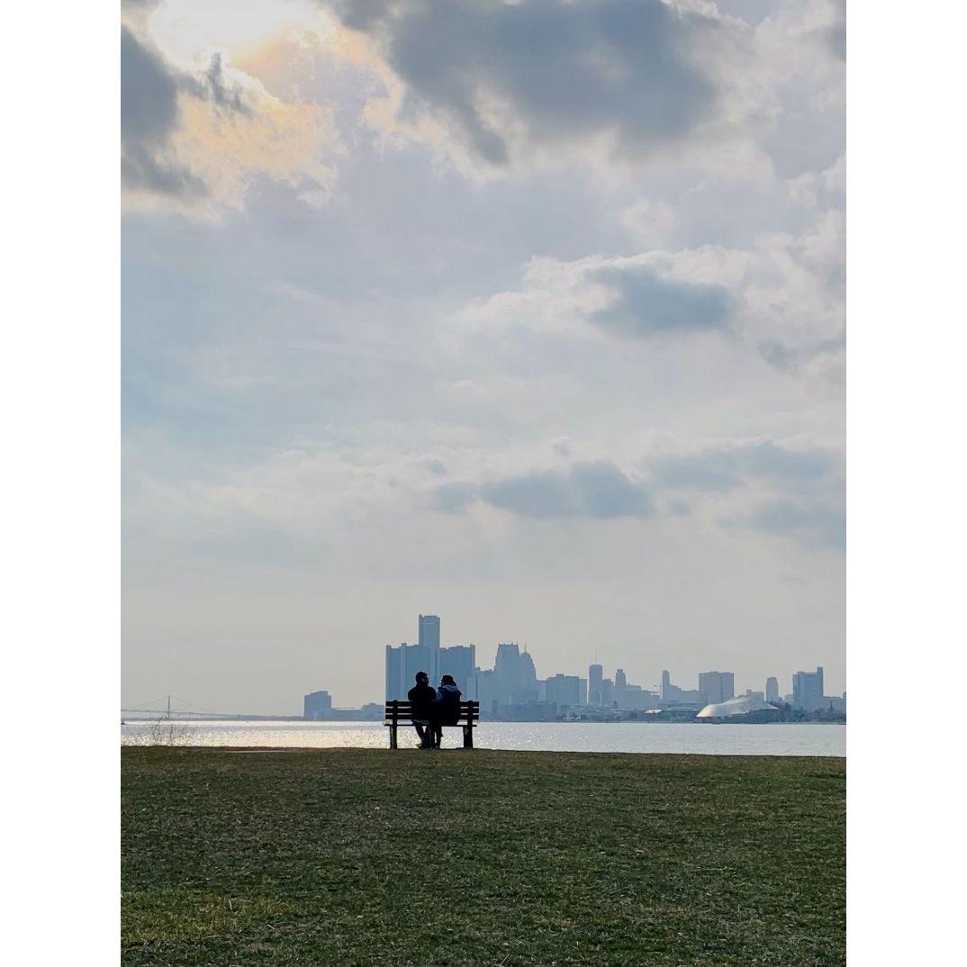 Someone snapped this picture of us overlooking Detroit from Belle Isle. The city will always have a special place in our hearts as that's where our relationship started.