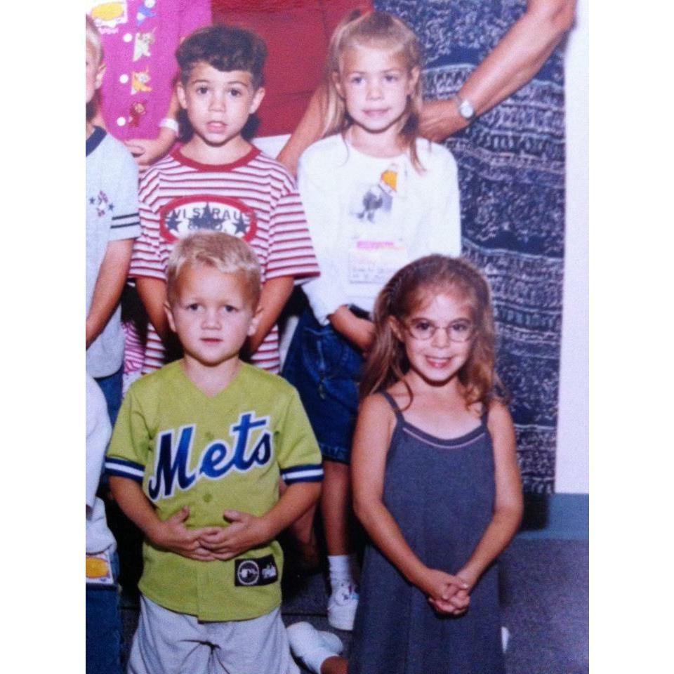 Our kindergarten photo! Darren is in the red and white striped tee and I am in the blue dress!